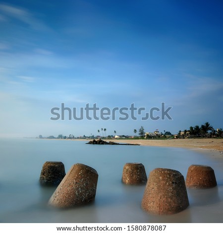 breakwater at Chendering Beach, located in Terengganu, Malaysia. slow shutter speed effect,Soft focus effect