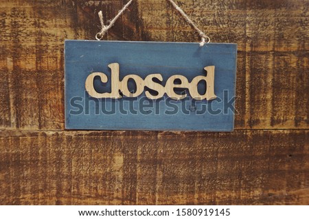 Wooden Closed sign with space copy on wooden background