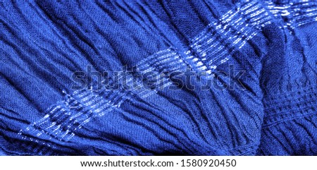 The texture of the background picture, the ornament of the decor, sapphire blue corrugated fabric, fabric with parallel or diagonal folds with serrated folds; products from such a fabric.