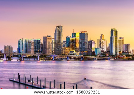 Miami, Florida, USA skyline on Bisayne Bay at dusk.