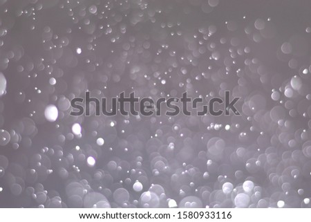 Abstract bokeh lights with light Silver background, beautiful bokeh from water droplets
