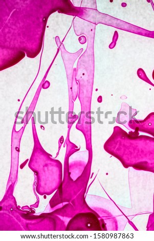 Colorful purple liquid stains on white background