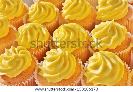 Cupcake's with yellow lemon frosting Happy Birthday celebration swirl sugar butter yellow lemon

icing lots in a row stock photo, stock photography image picture 







