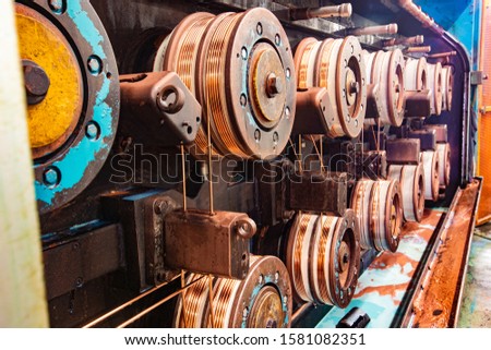 Old copper wire drawing machine Royalty-Free Stock Photo #1581082351