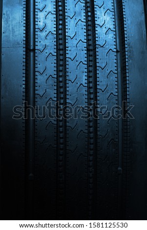 Blue tyre background. Car tyres close up.