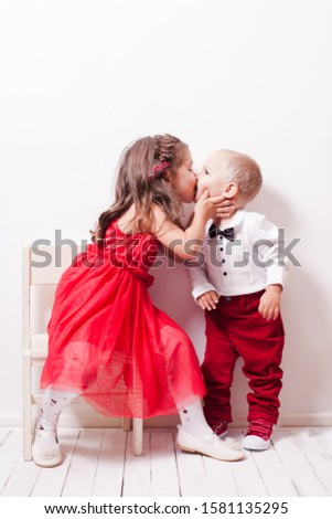 Family look brother and sister are kissing