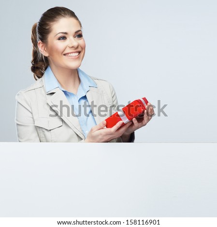 Smiling business woman red gift box hold. White card.