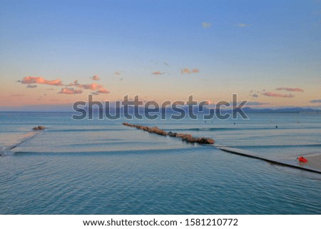 Photo taken on the island of Palma de Mallorca. The picture shows a picturesque view of the sea at sunset. The mountains are visible in the distance.