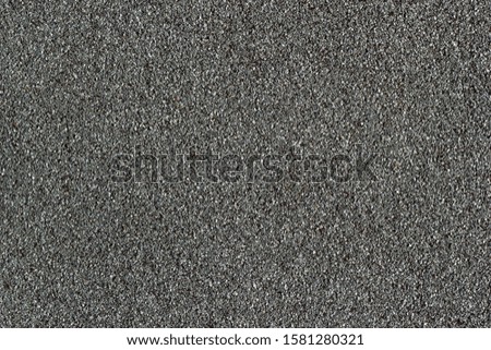 Uniform waterproofed building construction floor and stone gravel roofs. Textured colored gravel background.