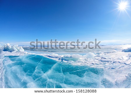 Winter Baikal lake landscape with Sun on blue sky Royalty-Free Stock Photo #158128088