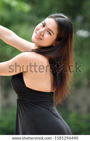 A Youthful Asian Woman Dancing