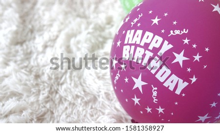 Image of ballon with Happy Birthday text on it