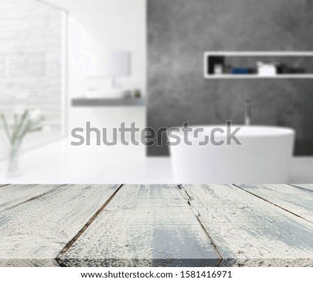 Empty tabletop for product display with blurred bathroom interior background
