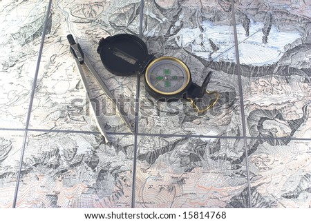 compass and conveyor on background of map