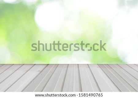 wood with blured green bokeh for background and space texture