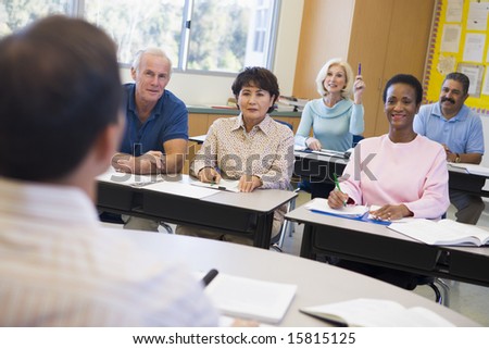 Mature students and their teacher in a classroom