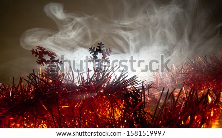 Christmas background have snowflake fir branches decorated with smoke