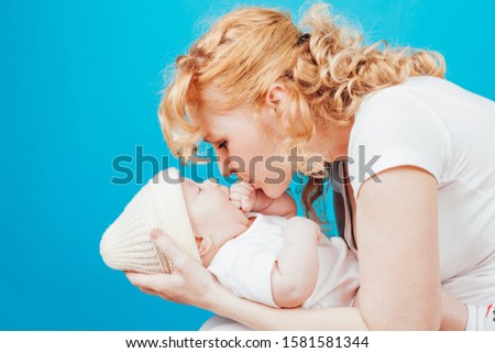 mom in white clothes with her son baby