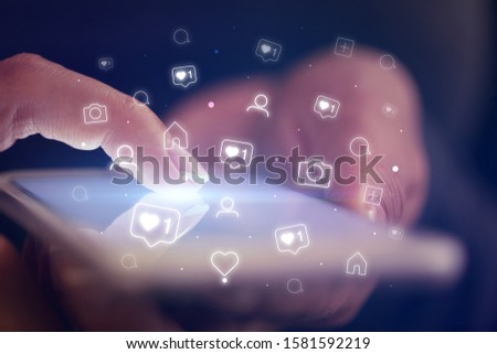 Finger touching phone with social media concept and dark background