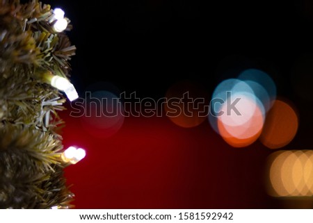 Christmas tree lights lamp illumination and festive blurred colorful bokeh dark night background  wallpaper pattern concept with empty copy space for your text here