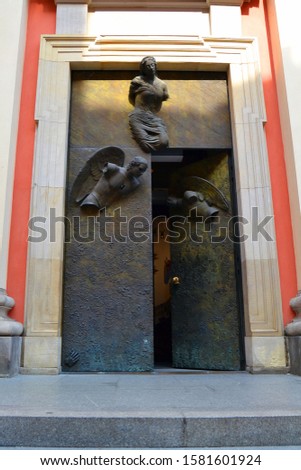 Entrance to the Church of the Blessed Virgin Mary (Jesuit Church) with bronze doors of an angel. Old Town (Stare Miasto), Warsaw, Poland