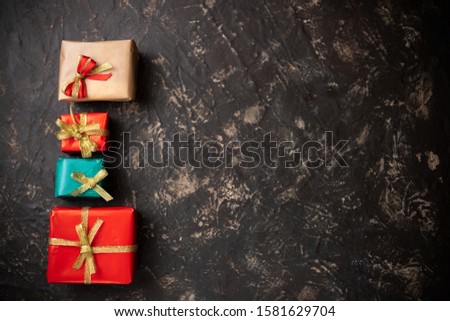 Christmas gifts and decorative objects with dark background top view with dark background