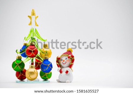 Christmas tree blank decorated with toys and a snowman