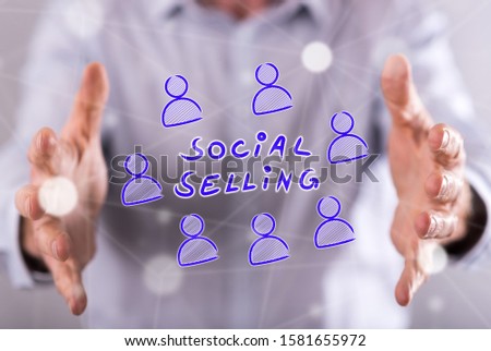 Social selling concept between hands of a man in background