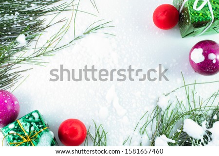Christmas frame decorated with ornaments and snow on white background,christmas border,copy space.flat lay,top view,top-down.