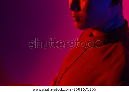 Fashionable Korean man in Studio on colored background