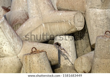 concrete tetrapods (traveling-wave protection) - background for port builders Royalty-Free Stock Photo #1581683449