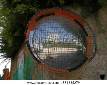 Reflection of road in the traffic safety mirror
