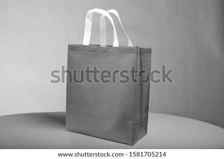 black color bag with White handle