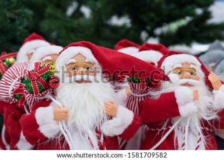 santa claus toy photo, Santa on Christmas tree background, cheerful santa, many small Santas, Christmas gifts, Christmas mood, background with santa, 