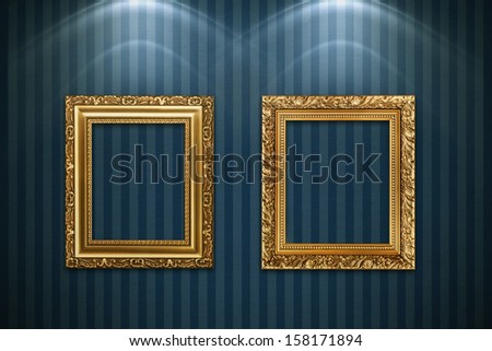 Antique frames on vintage wallpaper with realistic light