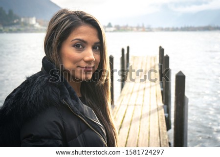 some pictures of a pretty girl at different places