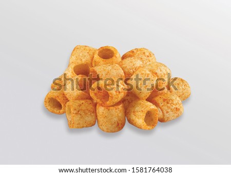 Fried and Spicy Tasty yellow salted pipe, Masala Cherry Ball Sncaks, Most famous and delicious wheat flour snack Children love them very much Snacks or Fryums (Snacks Pellets) Royalty-Free Stock Photo #1581764038
