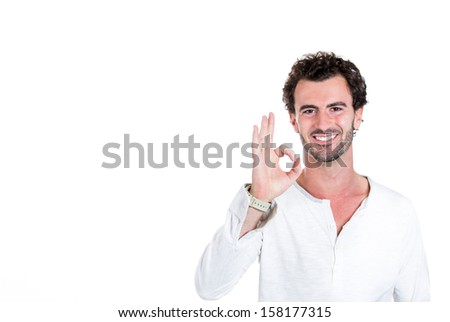 A closeup portrait of a handsome, young, happy, optimistic smiling guy telling you everything is OK, isolated on a white background with copy space. Positive human emotions and signs