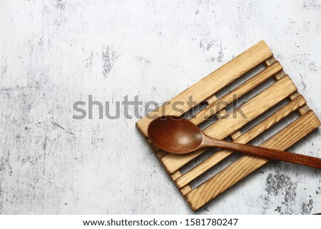 Flat lay of wooden spoon. Cooking concept picture. Brick base background.