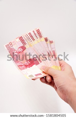 Indonesian Rupiah - official currency of Indonesia Royalty-Free Stock Photo #1581804505