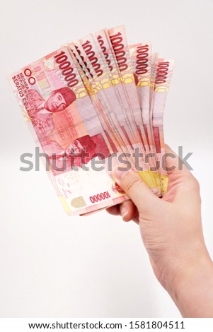 Indonesian Rupiah - official currency of Indonesia Royalty-Free Stock Photo #1581804511