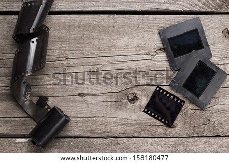 retro negative film and slides on wooden table