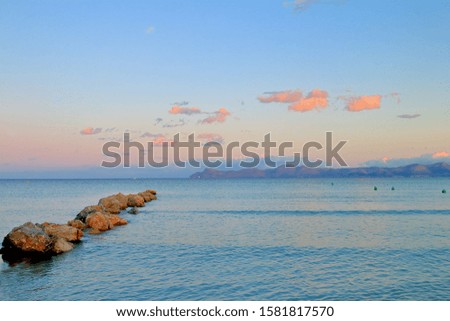 Photo taken on the island of Palma de Mallorca. The picture shows a warm evening in a quiet bay on the coast of the island.