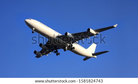 Long Range Wide Body Jet Plane - Transatlantic Airplane Royalty-Free Stock Photo #1581824743