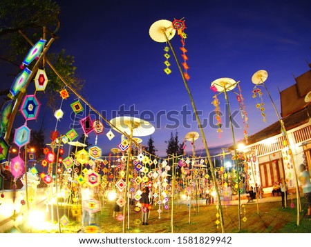 decorative local style hand crafted mobile flags along pathway and art street of KHON KAEN university in KHONKAEN province, THAILAND showing unique decorative style LOY KRATONG festival