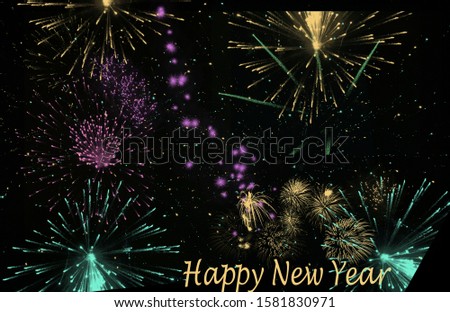 New Year's fireworks in different colors and shapes against a black background and greetings