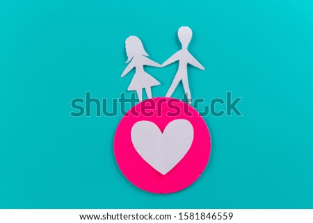 Cute boy and girl in love on blue background