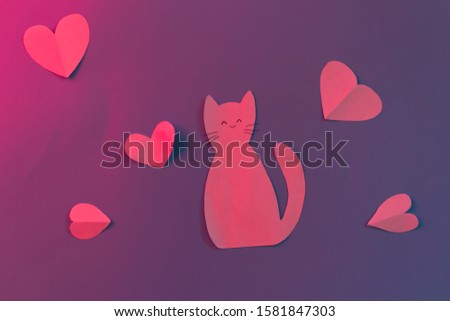 Paper cat and hearts on the blue background