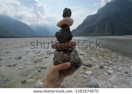 Stone balance amaro italia on a river