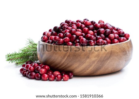 Fresh  cranberries in wooden bowl isolated on white 